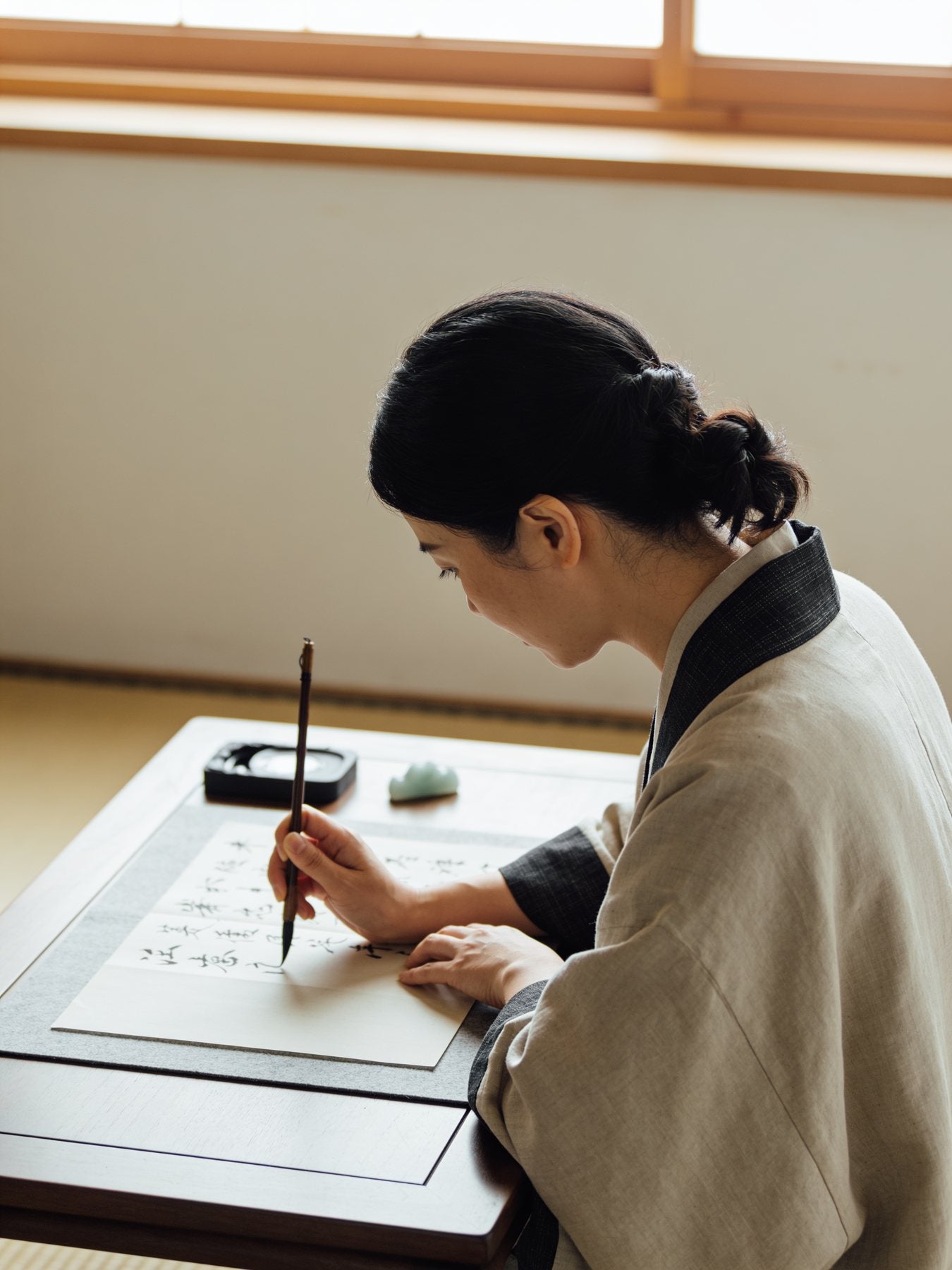 A reading being written by hand at MICHIBIKI